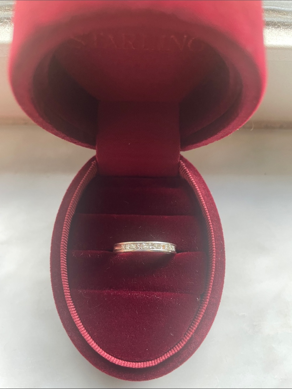 White gold diamond band, size 4 3/4, but can be sized